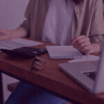 880 (6) 10 - Venture Forge A women reviewing finances to claim back tax