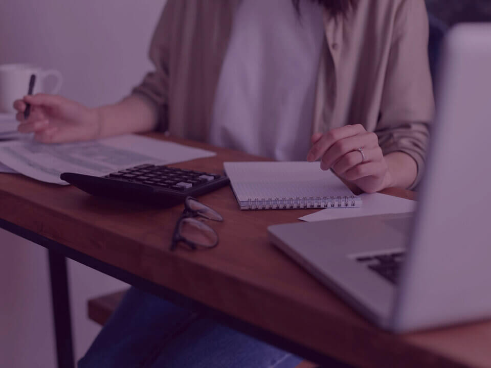 880 (6) 10 - Venture Forge A women reviewing finances to claim back tax