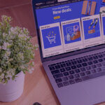Key Lessons from Prime Big Deals Day: The Power of Real-Time Data - Venture Forge Laptop displaying Amazon’s Prime Big Deal Days page, showcasing new deals, with a potted plant on the desk.