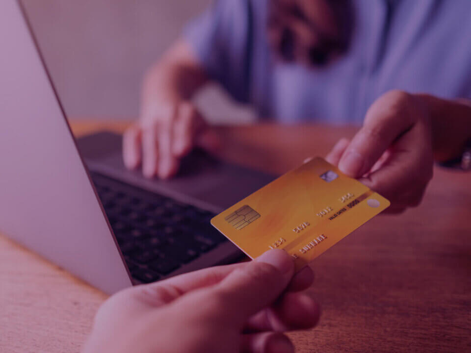 How is Black Friday’s late arrival redefining Q4 Sales Strategies on Amazon? - Venture Forge A person using a credit card for shopping online.