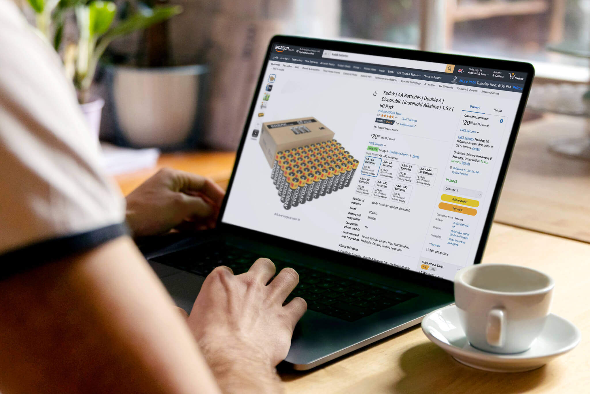 Person viewing Kodak product listing on Amazon laptop screen, representing Amazon Seller Services by Venture Forge.