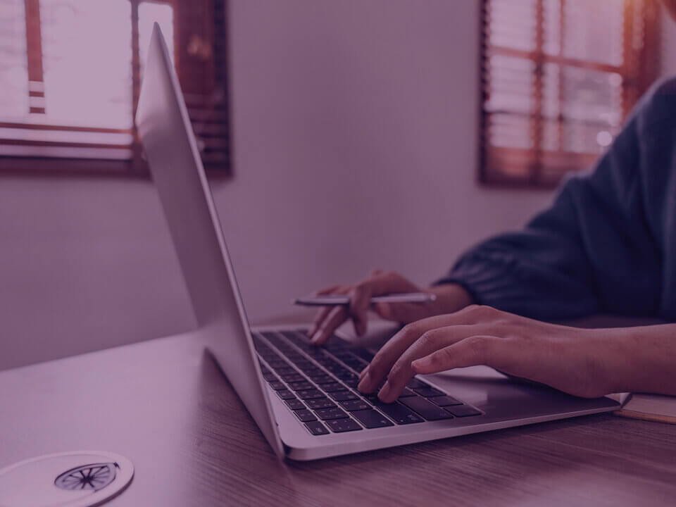 Women typing on a laptop