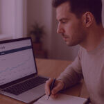 880 (8) 5 - Venture Forge Man reviewing data from Amazon Ads Dashboard
