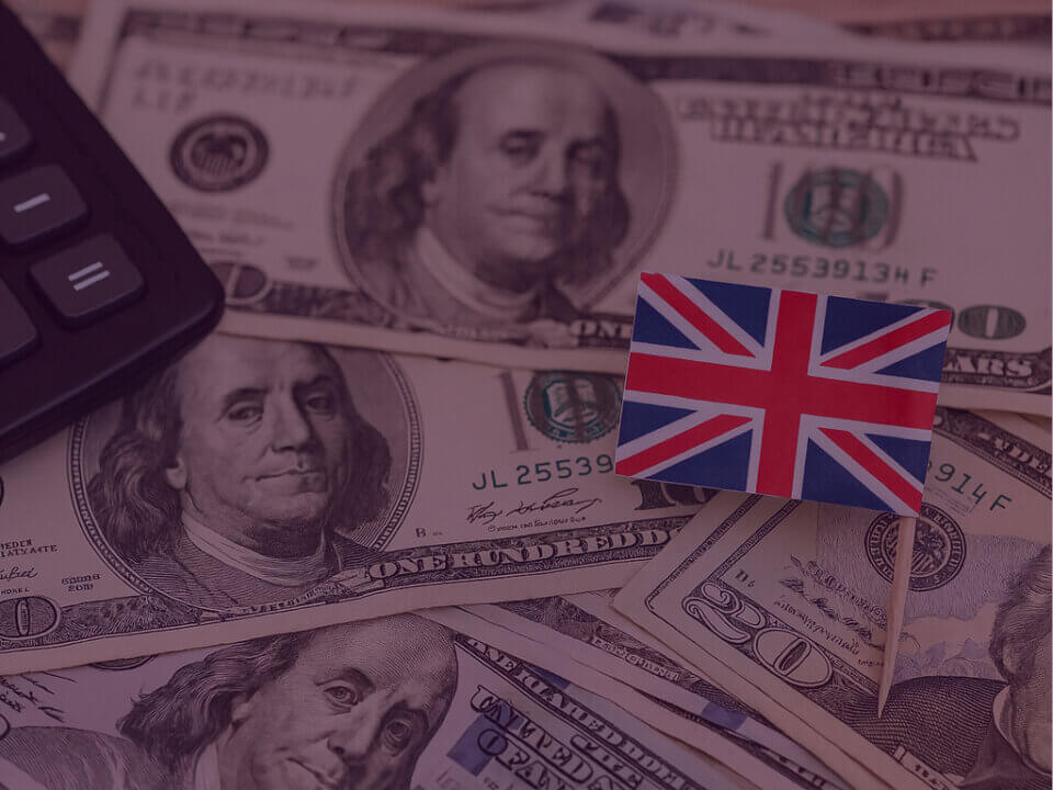 Image of different US money and UK flag
