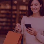 What Smart Brands will do differently now Prime Day is 4 days long - Venture Forge Image of women shopping during busy sales periods and ordering stuff on Amazon on her phone.