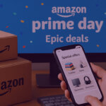 Hand holding a smartphone showing Amazon special offers, with Prime Day “Epic deals” banner and Amazon boxes in the background.