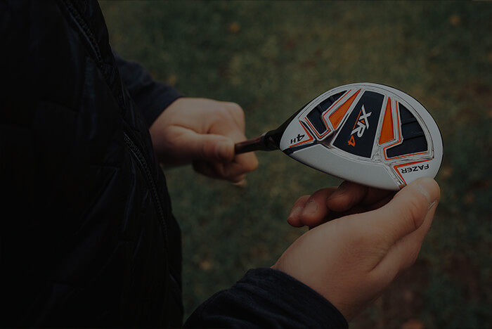 Close-up of a person holding a Fazer XR4 golf club, representing American Golf’s premium product range on Amazon.