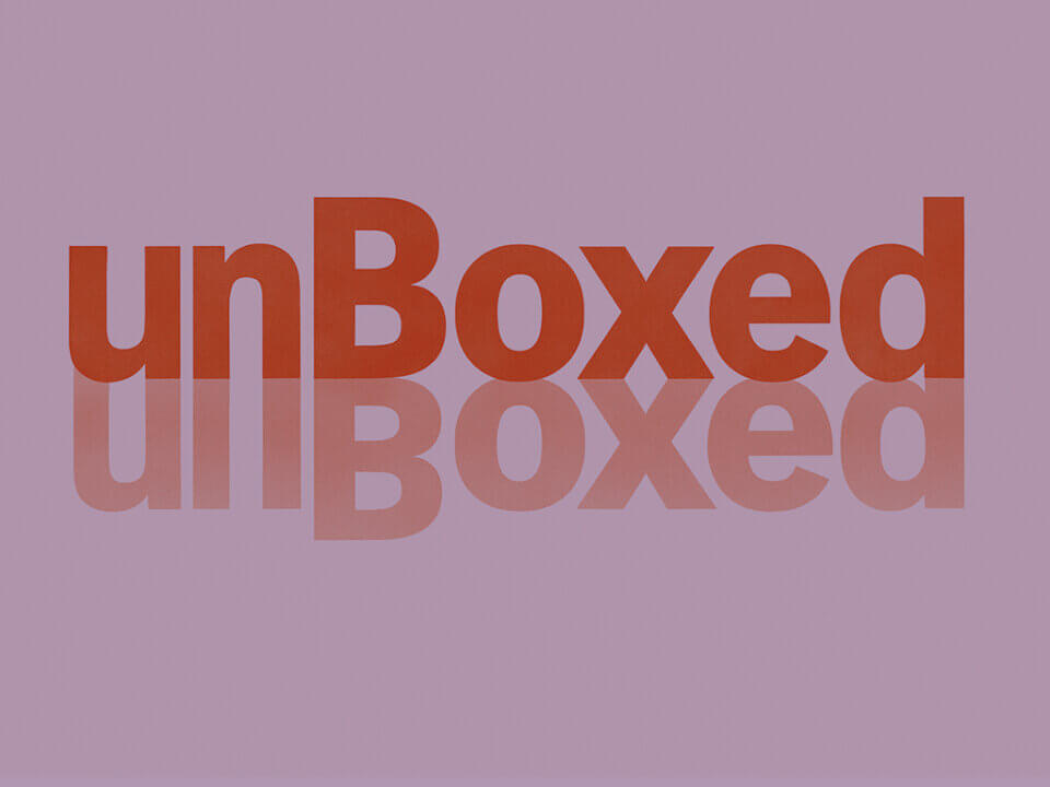 Amazon unBoxed 2025 event graphic featuring the unBoxed logo in red with reflective styling.