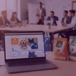 Cranswick 81% Amazon growth Vitalin case study image - Venture Forge Laptop showing Vitalin dog food Amazon results with 81% sales growth, 200% more units and 125% more repeat customers in a team meeting room.