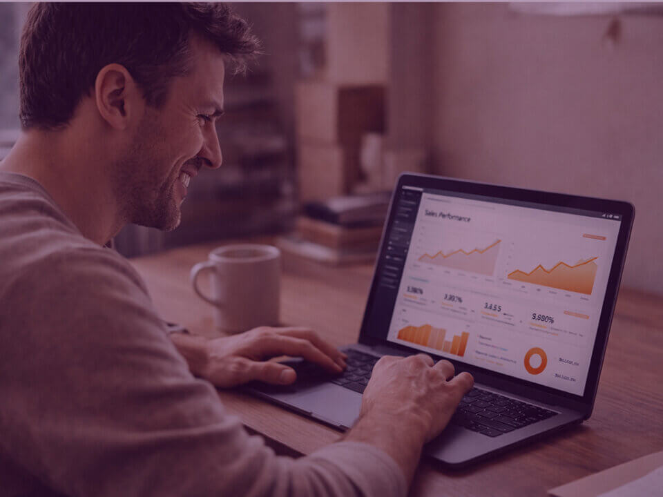 Business owner reviewing strong sales performance on a laptop during an Amazon deal event