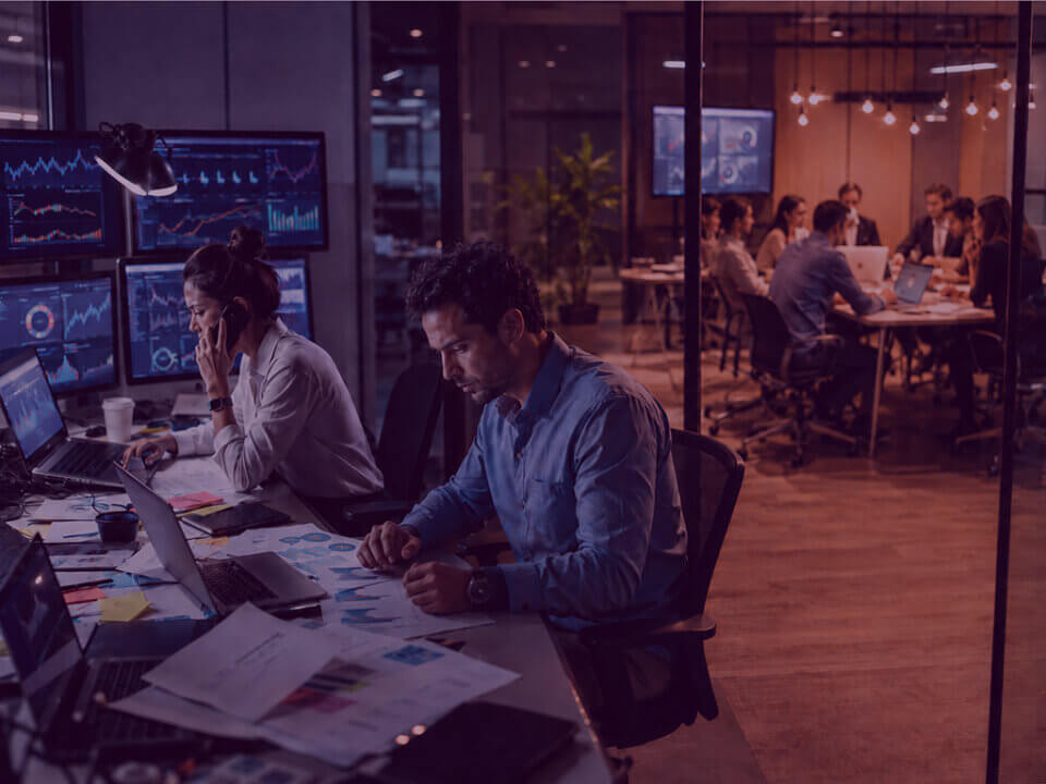 Two overstretched professionals manage complex Amazon Vendor account data while a larger team collaborates calmly in the background.