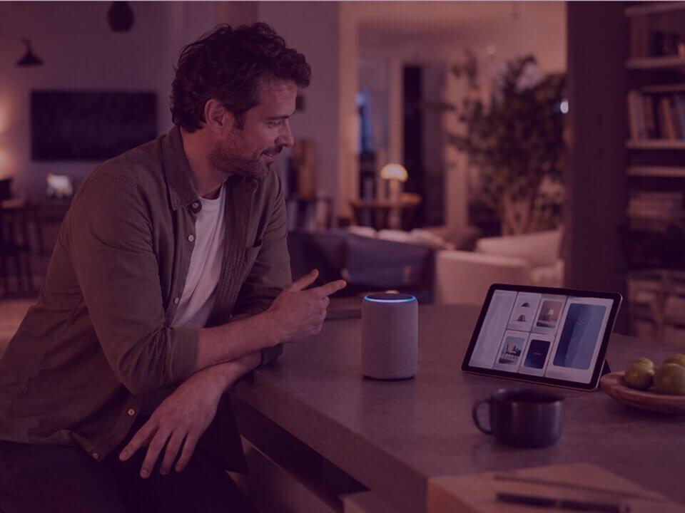 Alexa for Shopping and AI Product Discovery - Venture Forge Person using an AI shopping assistant and product discovery interface in a modern home